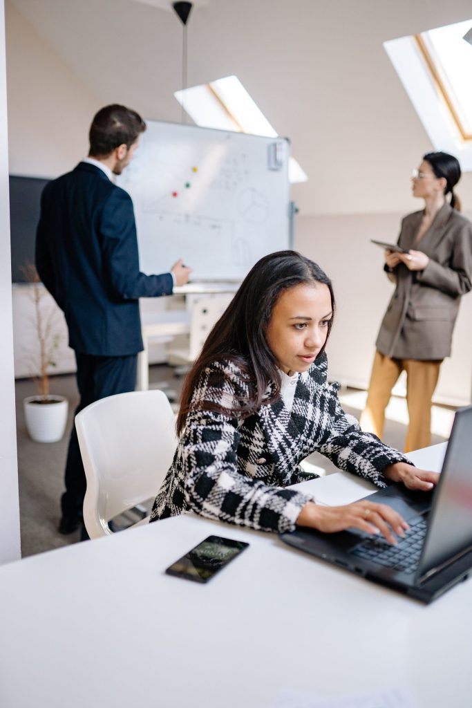 Focused teamwork in a modern office with diverse professionals working efficiently.
